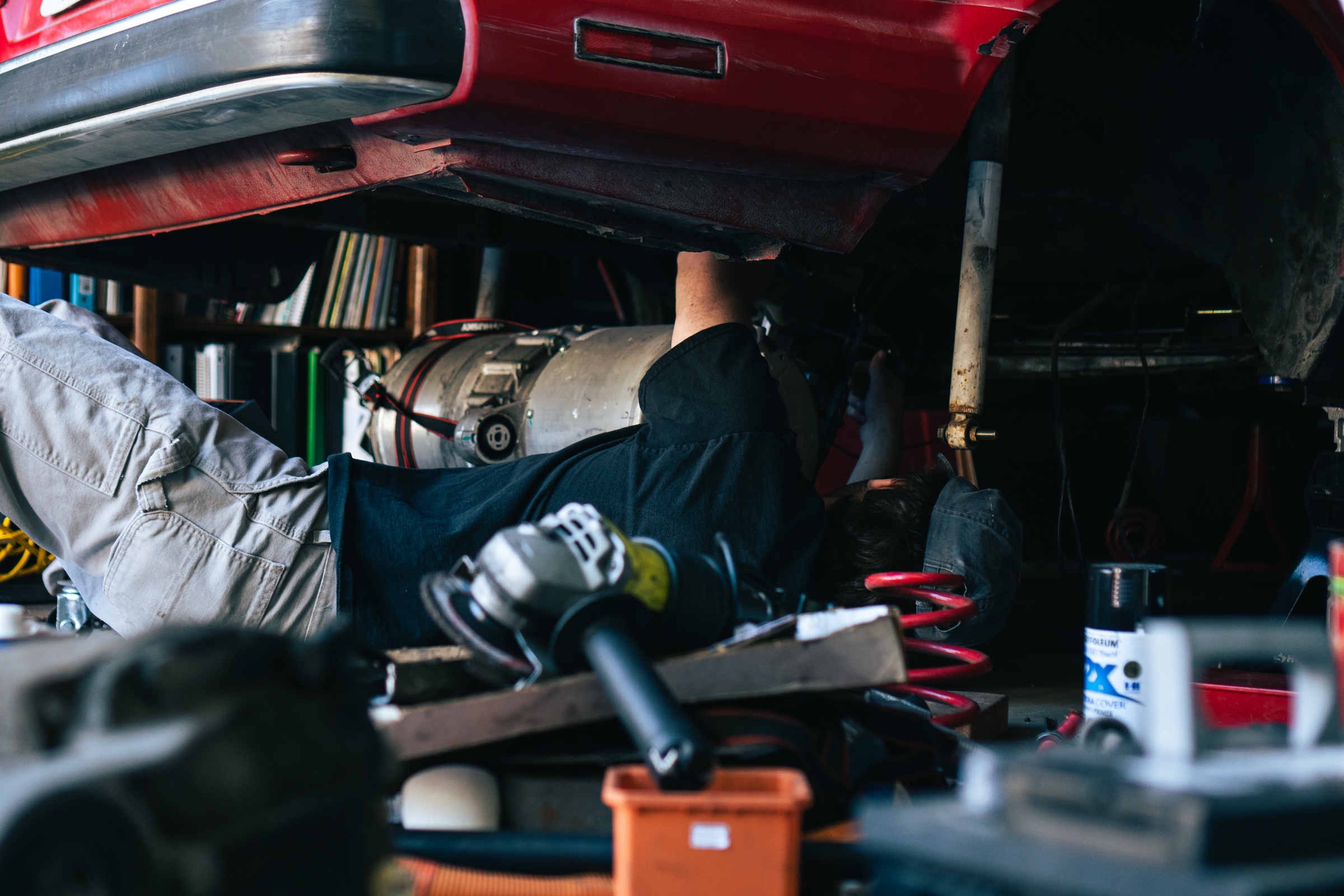 Working beneath the Electric E30 during the conversion